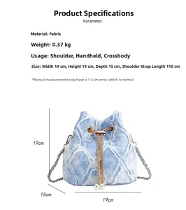 Detail showing blue denim bucket bag with frayed edges and pearl chain shoulder strap