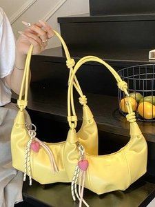 Chic yellow crescent moon handbag with heart charm and adjustable shoulder strap
