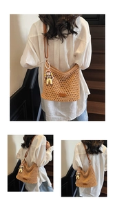 Detail of woven beach tote with brown leather strap and cute cartoon doll charm