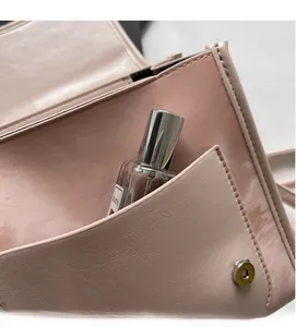 Pink lychee texture leather backpack interior with metal magnetic closure and pocket