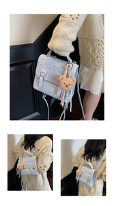 Detail of light blue leather backpack with rhinestone flap and cute bear pendant