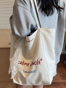 Minimalist canvas tote bag with French embroidery and lace bow for women's daily commute