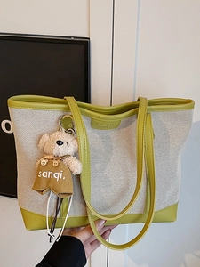 Large capacity canvas tote bag with green leather trim and cute teddy bear pendant