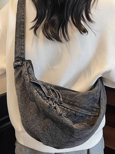 Minimalist charcoal grey washed denim crescent crossbody bag with wide adjustable strap