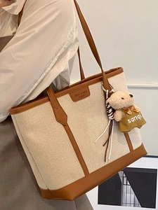 Large canvas commuter tote bag with brown leather trim and cute bear charm pendant
