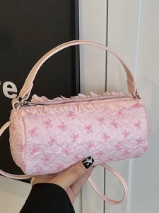 Pink cylinder bow handbag for women with textured pattern and frill detail