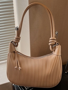 Elegant apricot pleated hobo bag with knotted strap and silver chain details
