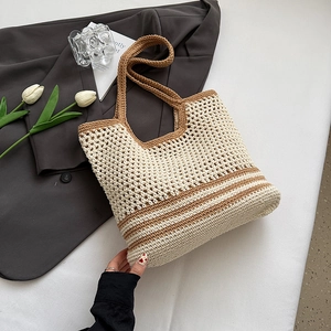 Detailed close-up of woven cotton tote bag with stylish hollow texture and stripes