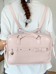 Pink PU leather JK style backpack with heart pendant and bow decoration for women