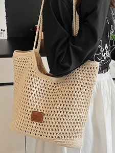 Beige crochet woven shoulder bag with leather tag for women casual beach vacation style