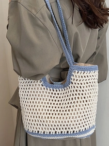 Chic hollow-out cotton crochet tote bag with blue trim for beach holidays