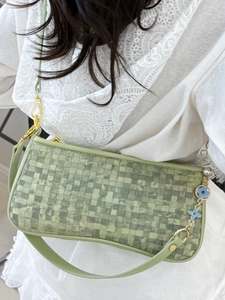 Green checkered woven underarm bag with gold chain and blue flower charm for women