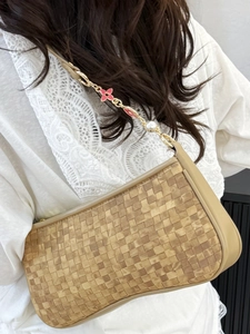 Chic beige checkered woven baguette bag with gold floral chain and pearl detail