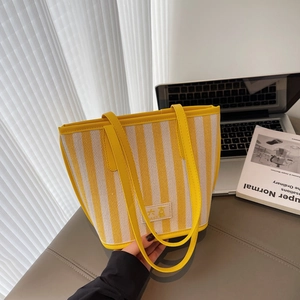 Large striped tote bag with yellow and cream patterns for stylish urban daily commuting