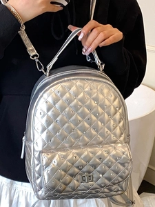 Silver metallic quilted backpack for women featuring rhinestone studs and chain strap