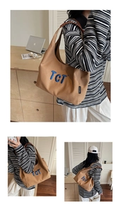 Detailed views showing brown canvas tote with blue TCT embroidery and leather straps