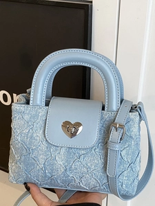 Light blue denim heart-quilted handbag with chain strap and silver heart-shaped lock
