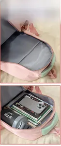 Detailed internal display showing spacious compartments of this aesthetic school backpack