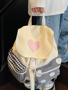Chic color-block backpack for women in pale yellow with a cute pink heart label