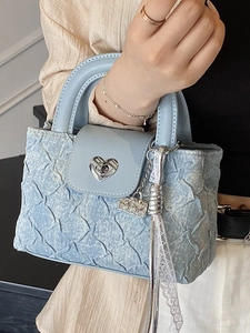 Light blue denim quilted handbag with silver heart buckle and chain strap for women