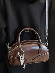 Vintage dark brown bowling handbag with silver hardware and shoulder strap for women