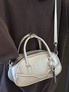 Silver retro bowling handbag with metallic crinkle texture and adjustable strap