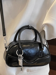 Retro black bowling bag for women with silver lock pendant and adjustable shoulder strap