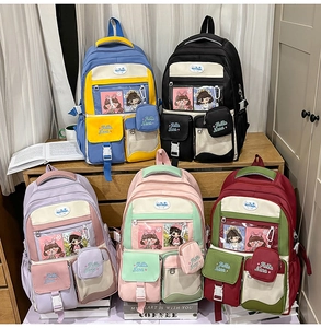 Detail of five Japanese style backpacks with transparent heart-shaped ita-bag pockets