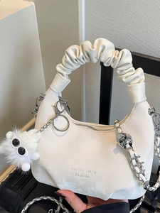 White pleated cloud shoulder bag with silver chain and cute plush monster charm