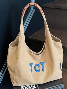 Sac cabas chic en toile pour femme avec broderie TCT bleue et anses en cuir pour travail