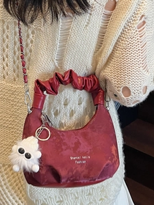 Red half-moon pleated cloud bag with chain strap and cute plush charm for women
