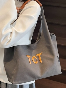 Sac fourre-tout en toile grise avec broderie TCT orange et anses marron chic
