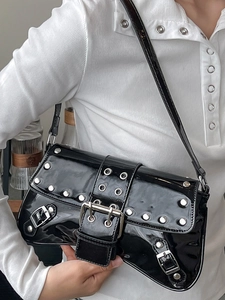Y2K style black patent leather shoulder bag with silver studs and metal buckles