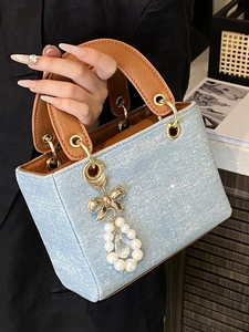 Chic blue denim square handbag with rhinestones, brown leather handle and pearl charm