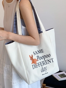 White canvas tote bag with dog print and checkered strap for daily student commute