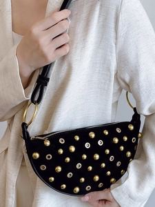 Vintage punk style black suede crescent bag with gold metal eyelets and rivets detail