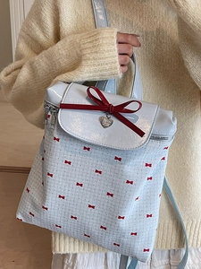 Zaino celeste capiente da donna con fiocchi rossi e motivi floreali per ufficio e scuola
