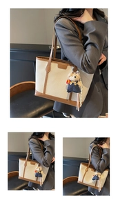 Detail of woven tote bag with brown leather trim and cute teddy bear pendant charm