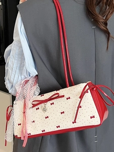 Chic red and white polka dot shoulder bag with bow and heart charm for women
