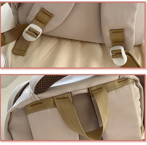 Detail view of adjustable wide shoulder straps and reinforced handle on a beige backpack