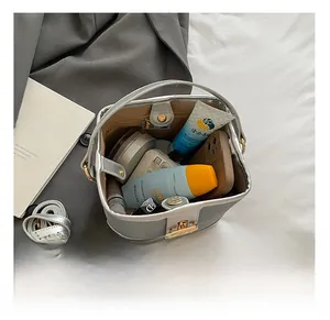 Top view showing the spacious interior of the silver bucket bag with daily essentials