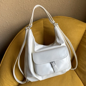 Minimalist cream white PU leather large tote bag with silver buckle and adjustable straps
