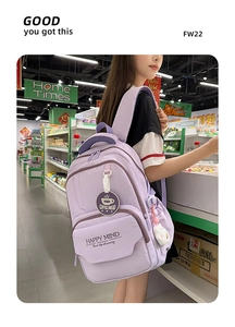 Detail of lavender purple backpack with multiple zipper pockets and cute plush bunny charm