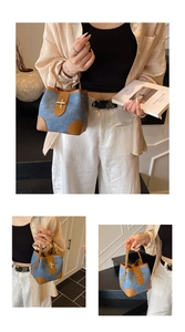 Detail showing denim blue bucket bag with brown leather trim and golden metal turn-lock