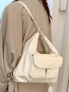 White high-gloss faux leather tote bag for women showing large capacity and commuter style