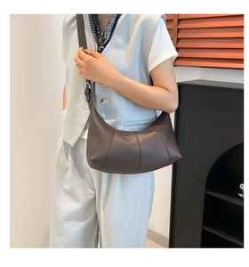 Deep brown crescent shoulder bag with litchi texture and adjustable strap detail