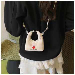Detail of beige plaid bucket bag with cute dog embroidery and white lace trim