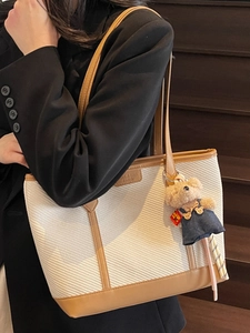 Minimalist canvas tote bag with brown leather trim and cute bear charm for women