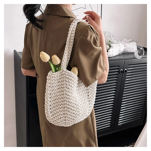Detail of bohemian handmade crochet tote bag with thick cotton rope weave and open U-shape