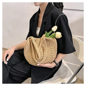 Close-up of handmade crochet hollow straw tote bag with intricate woven texture details